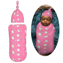 Muishi newborn swaddle with matching hat set adds warmth and style.