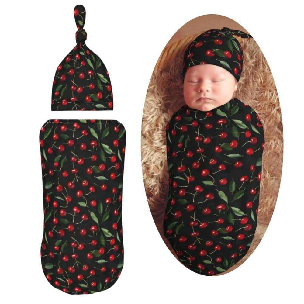 Muishi Red Cherrys with Leaves swaddle blanket close-up showing soft, skin-friendly fabric.
