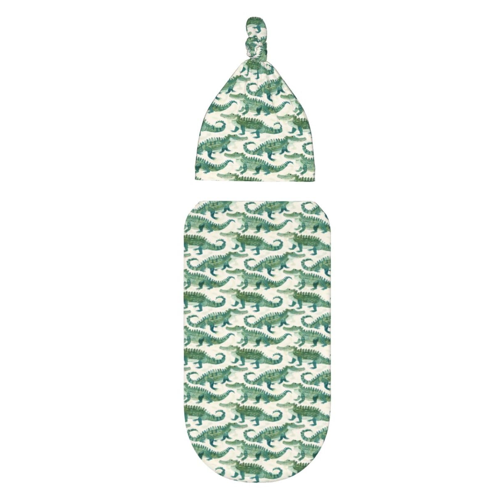 Muishi crocodiles baby sleeping in swaddle for comfort.