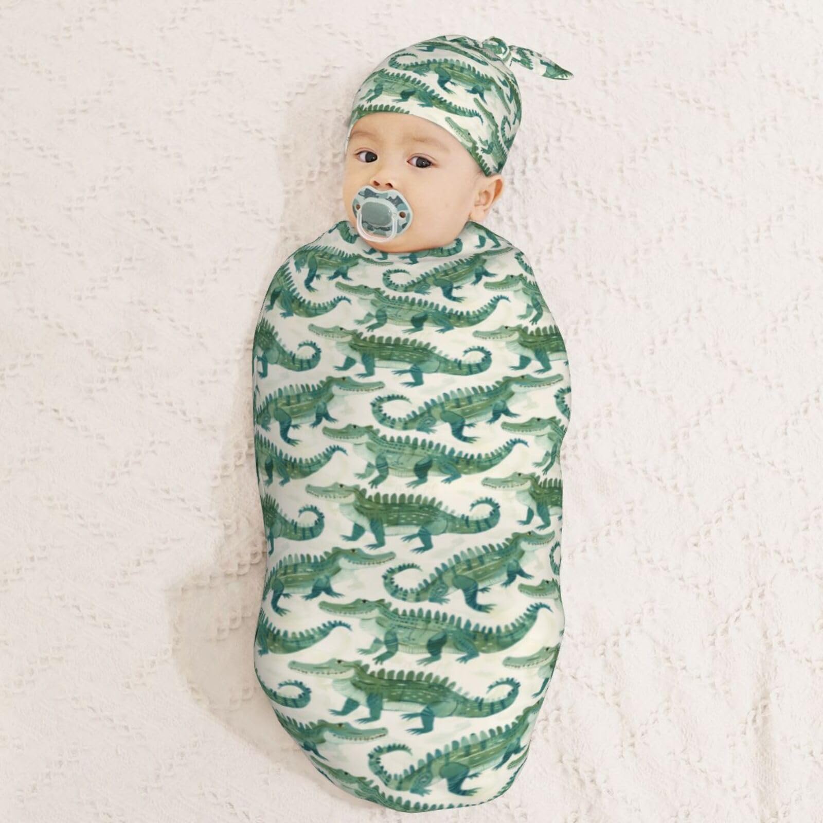 Muishi watercolor crocodiles hat on a newborn.