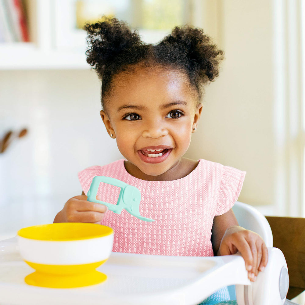 Munchkin Baby Toon silicone spoon with patented design reduces gag risk during meals