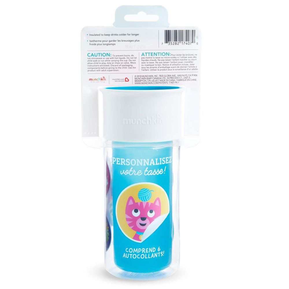 Munchkin Miracle 360 blue child holding cup during a drink