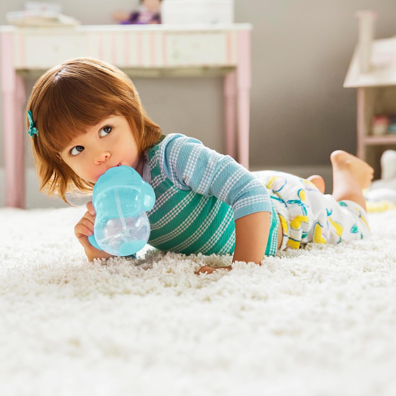 Munchkin Weighted Straw Cup easy-grip-handles aid small hands learning to hold securely.