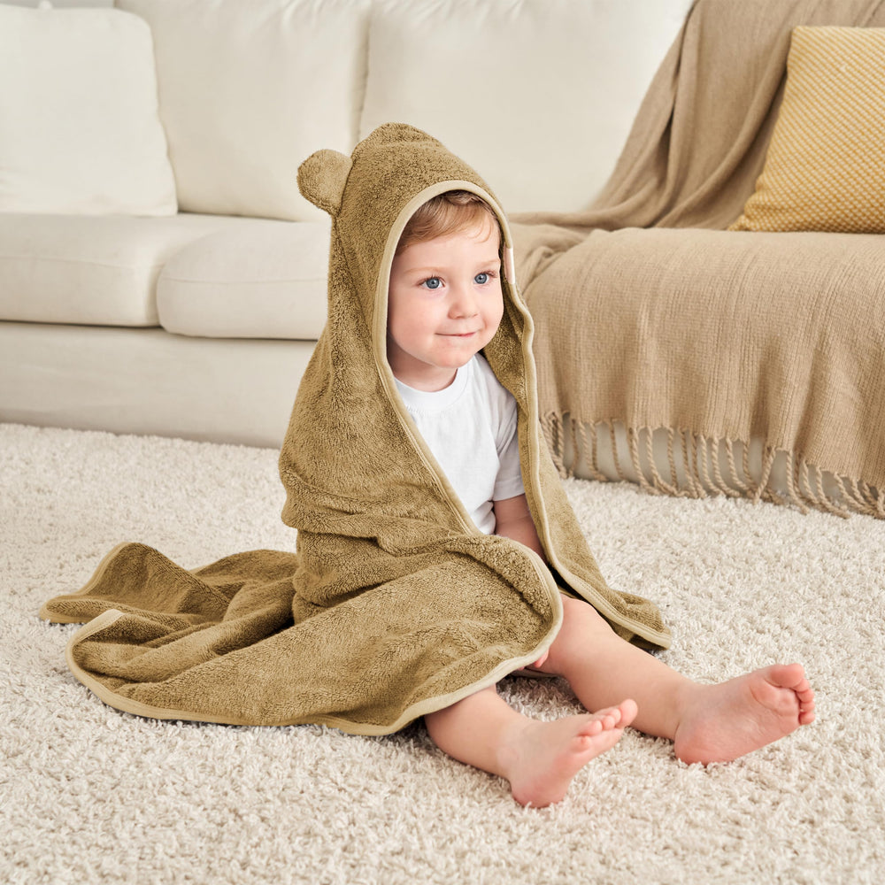Munich Blue generously sized hooded towel tackles wriggles after baths.