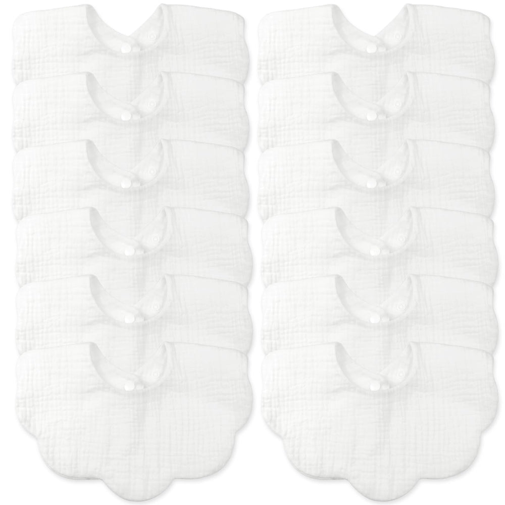 MUSBUY baby bib closeup showing four-layer muslin softness for gentle feeding.