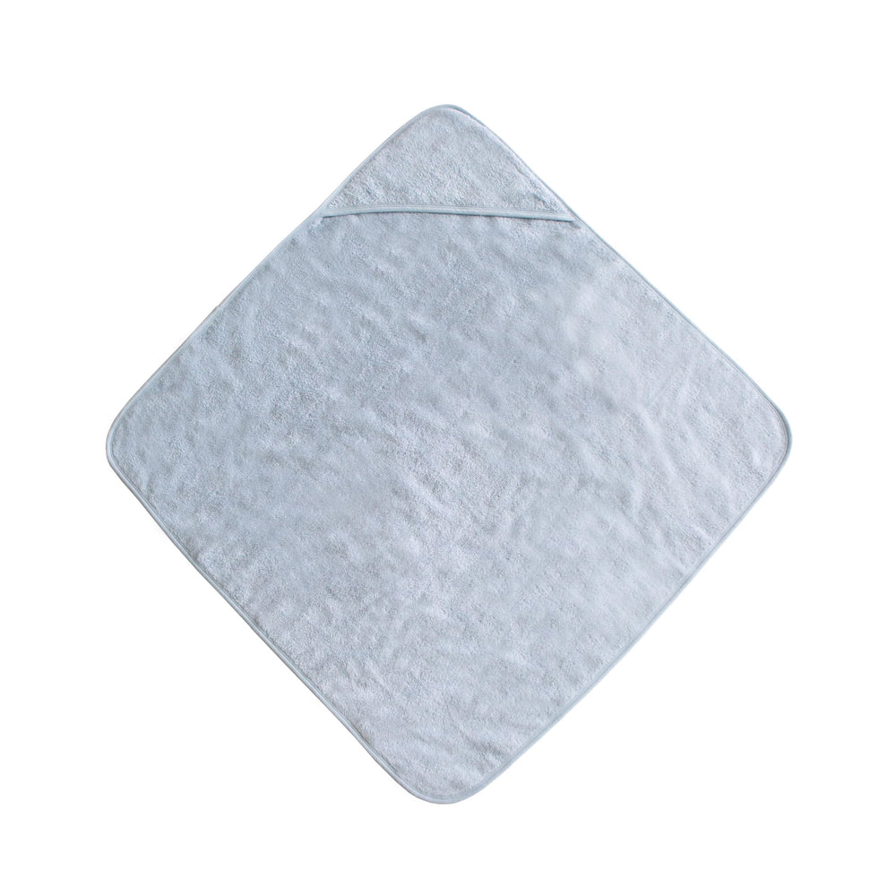 Mushie hooded towel baby blue absorbs water for quick post-bath drying.