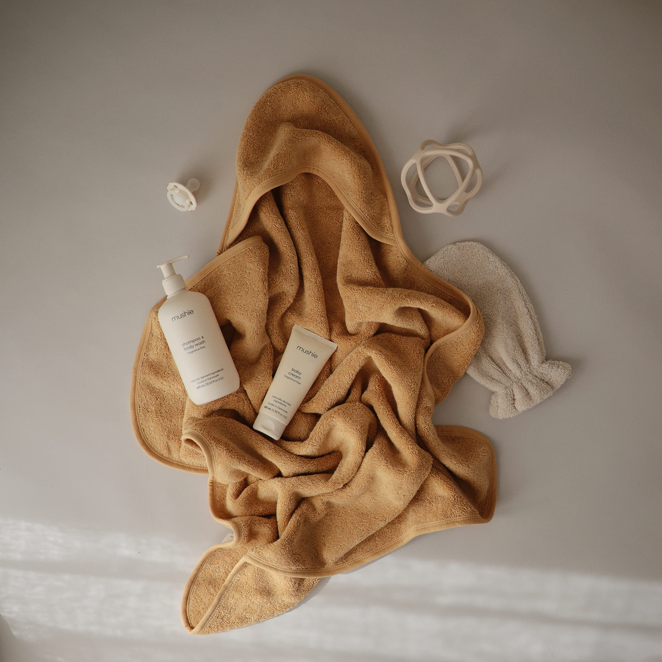 Mushie hooded towel machine-washable for busy parent routines.