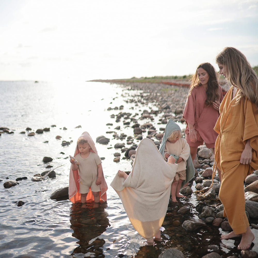 Mushie Baby Hooded Towel one-size design fits growing toddlers.