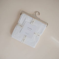 Mushie Baby Hooded Towel Pearl attached hood closeup highlighting cozy head warmth.