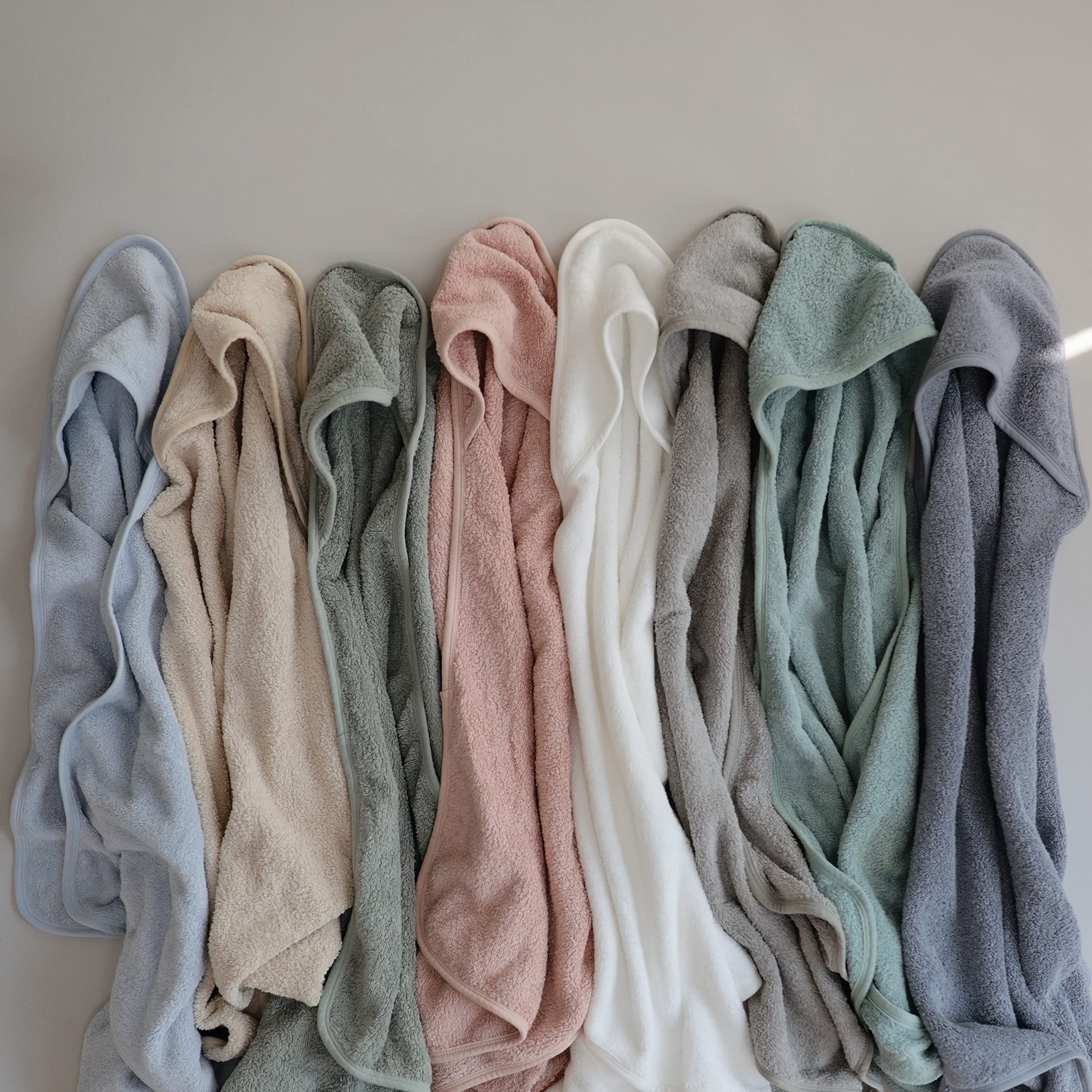 Mushie Baby Hooded Towel Pearl color closeup highlights calm, gentle bath time routine.