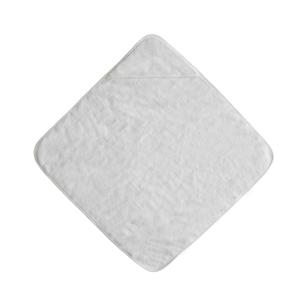 Mushie Baby Hooded Towel Pearl on baby wrapped for warm, gentle drying.