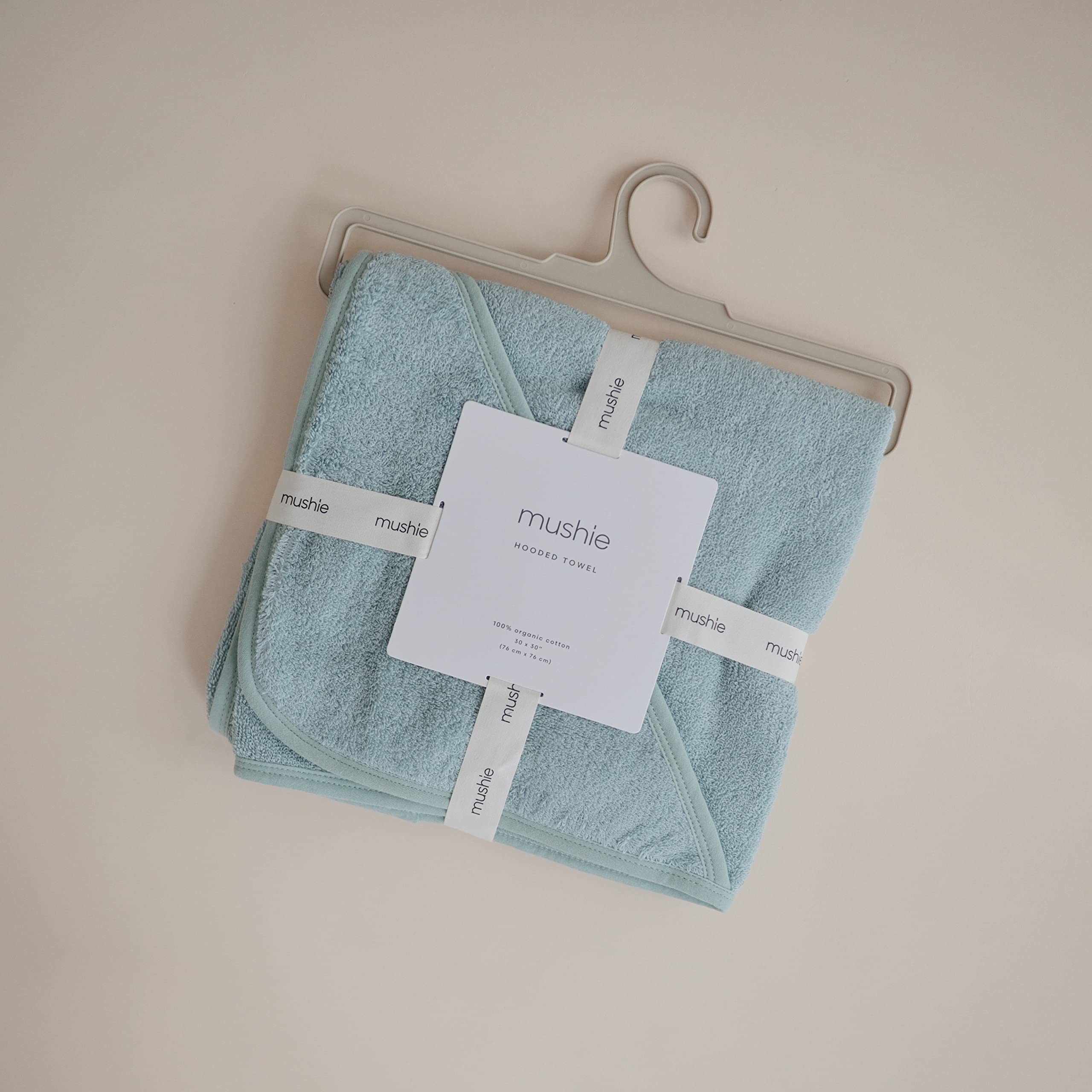 Mushie baby hooded towel Sea Mist drying, absorbent cotton stays warm and comfy.