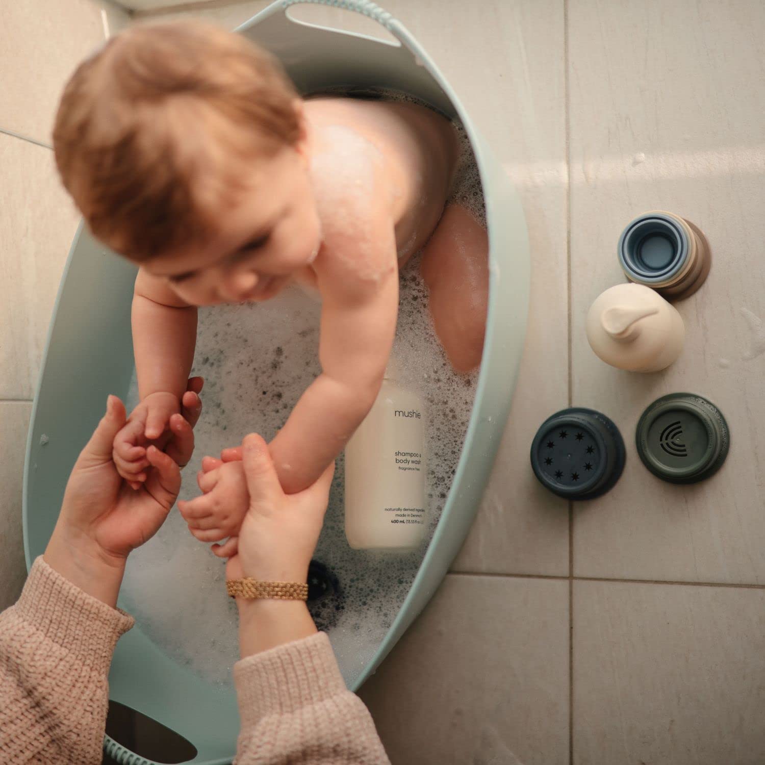 Packaging design reflecting Mushie's Danish origins and gentle baby care