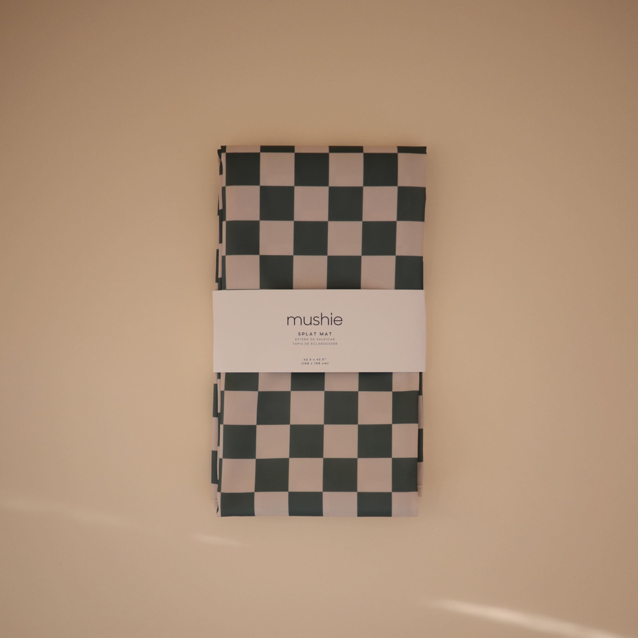 Mushie Olive Check mat protects tables during messy meals