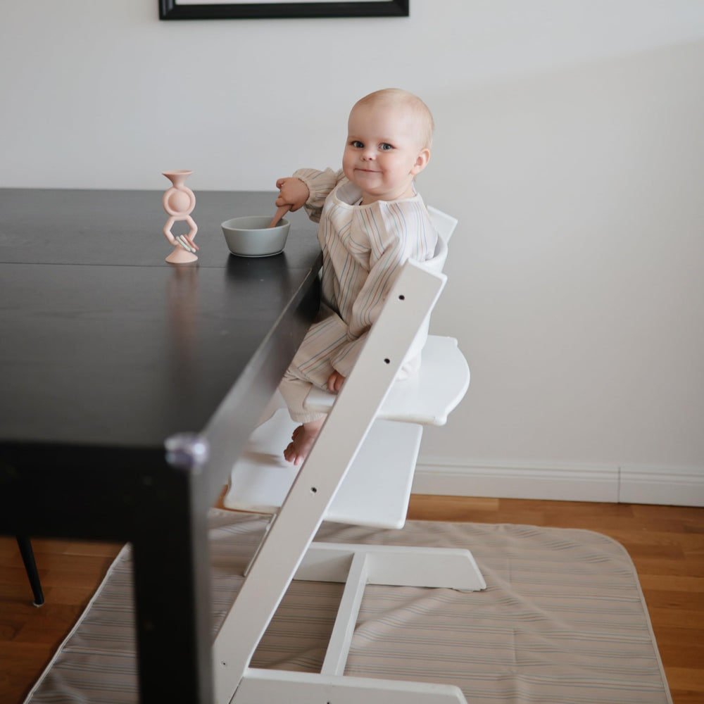Mushie Splat Mat machine washable for bigger spills and easy care