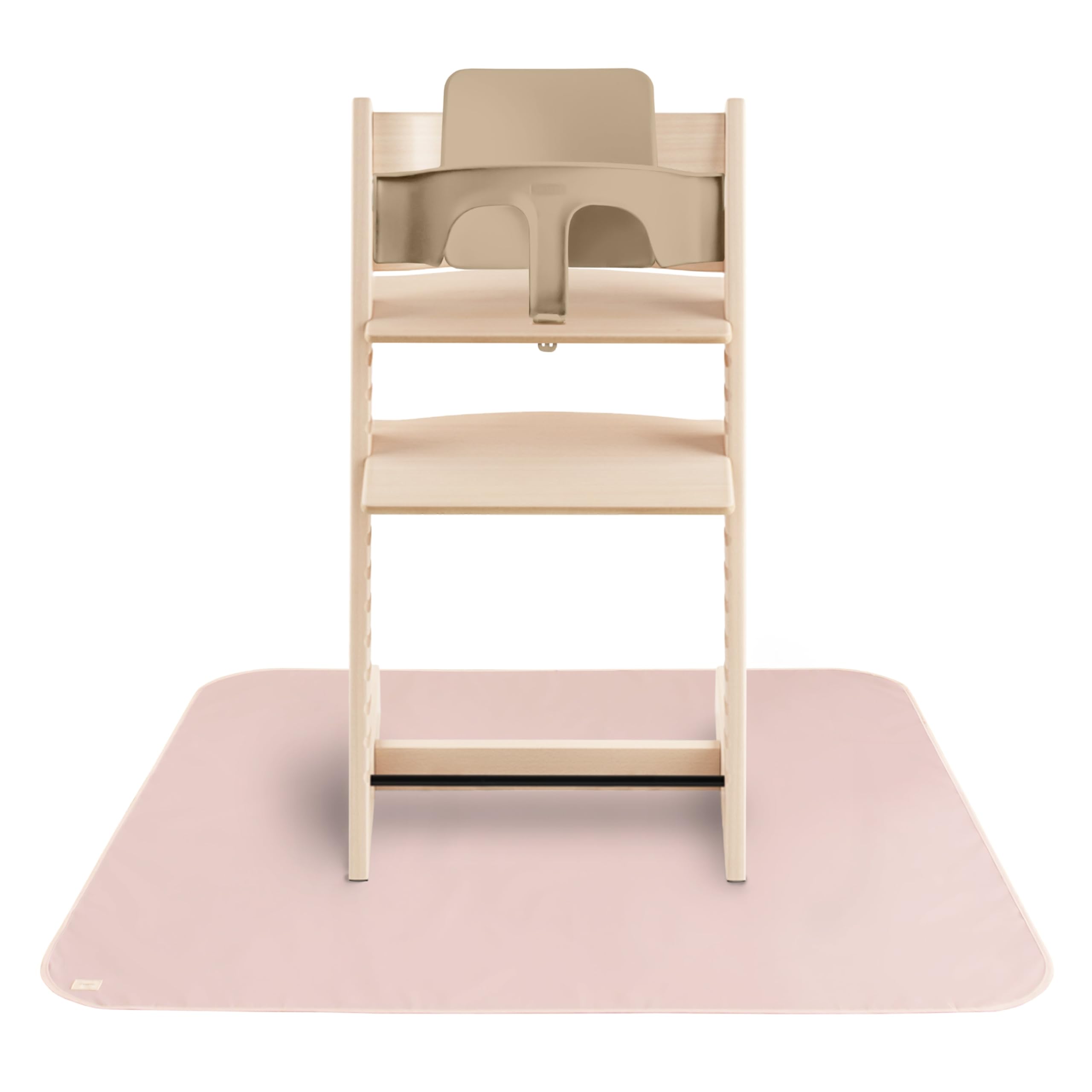 Mushie Baby Splat Mat under high chair protects floors during meals.