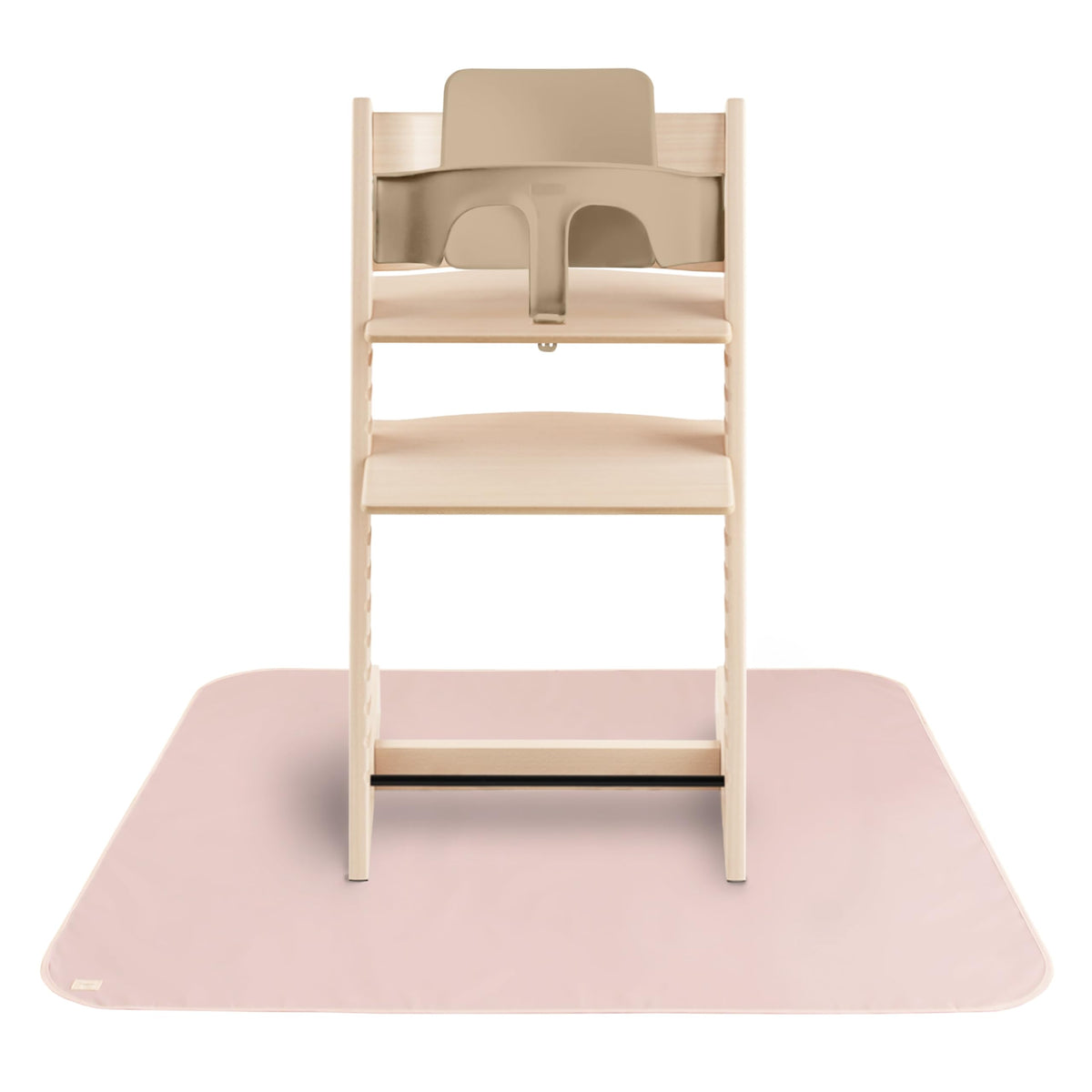 Mushie Baby Splat Mat under high chair protects floors during meals.