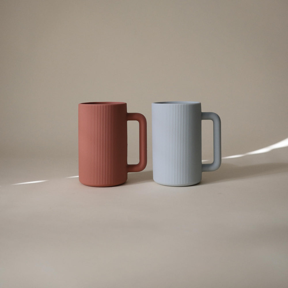 Mushie rinse cup top rack dishwasher safe for easy cleaning.