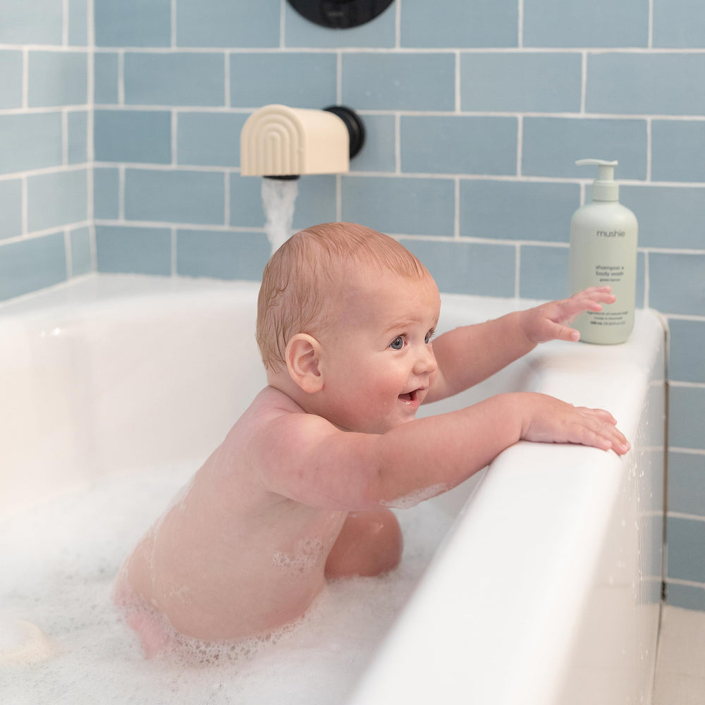 Mushie bath spout cover durable silicone ensures long-lasting tub safety.