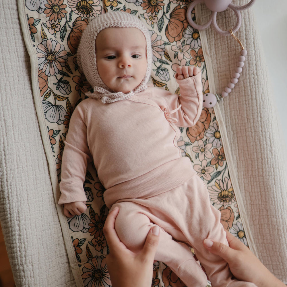 Mushie changing pad liner is machine washable for quick cleaning