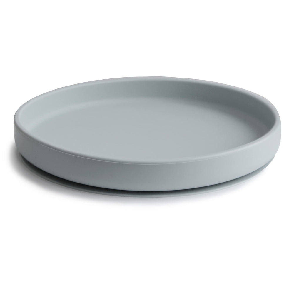 Mushie Classic Silicone Suction Plate stone on table during kid-friendly mealtime.