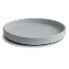 Mushie Classic Silicone Suction Plate stone on table during kid-friendly mealtime.