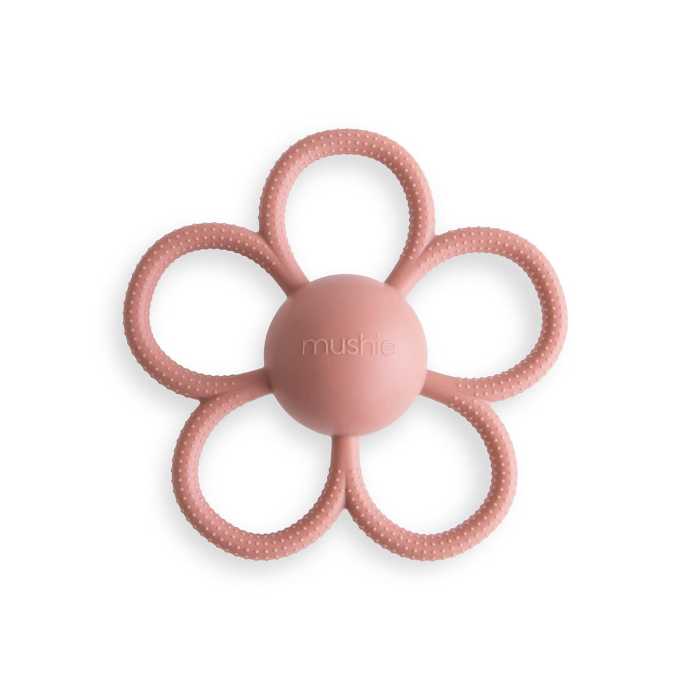 Mushie Daisy Rattle in Dusty Rose close-up showing soft silicone texture for soothing gums.