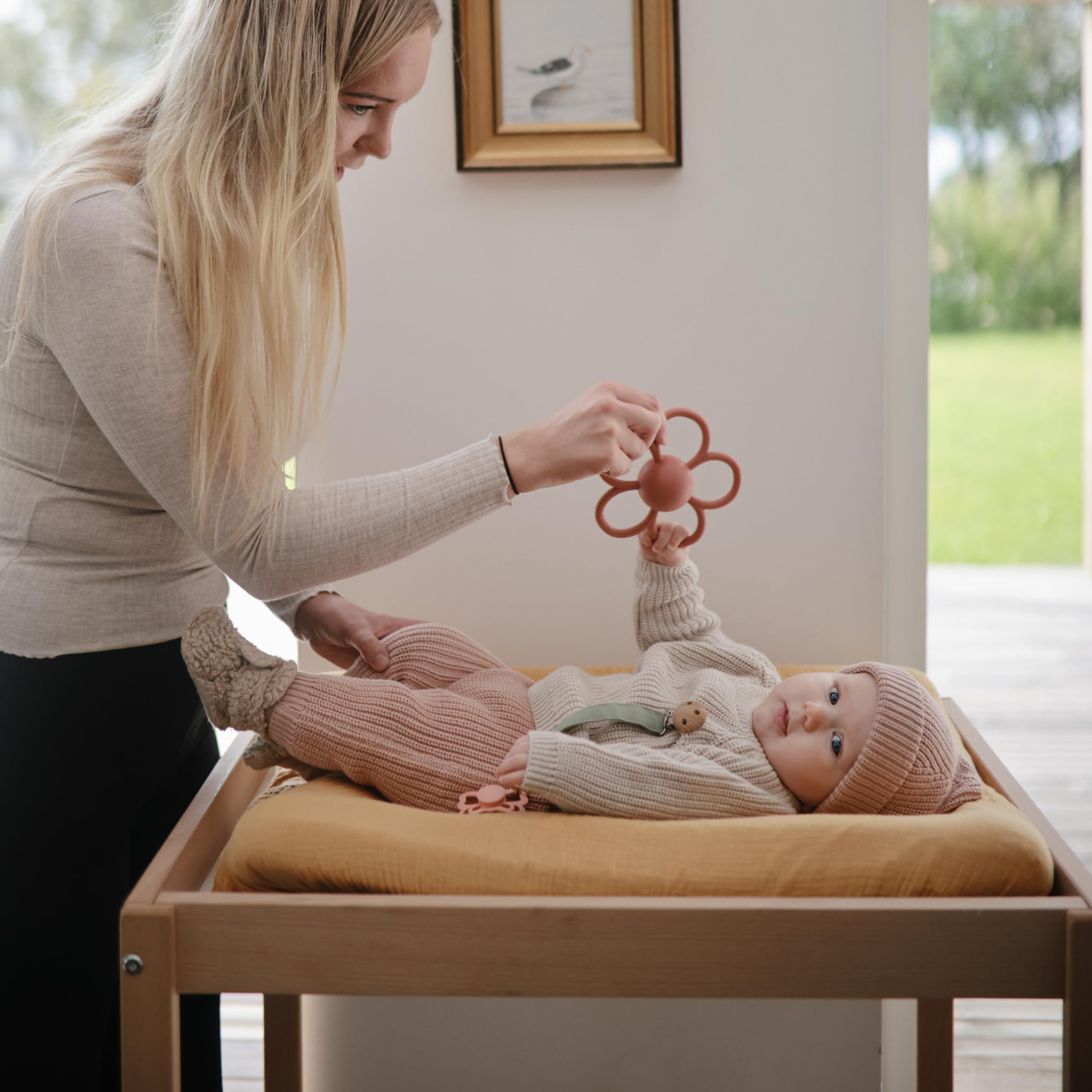 Mushie Daisy Rattle safe soft silicone emphasizes non-toxic materials.