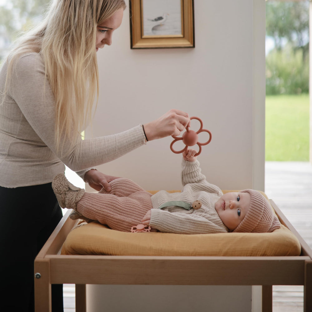 Mushie Daisy Rattle safe soft silicone emphasizes non-toxic materials.