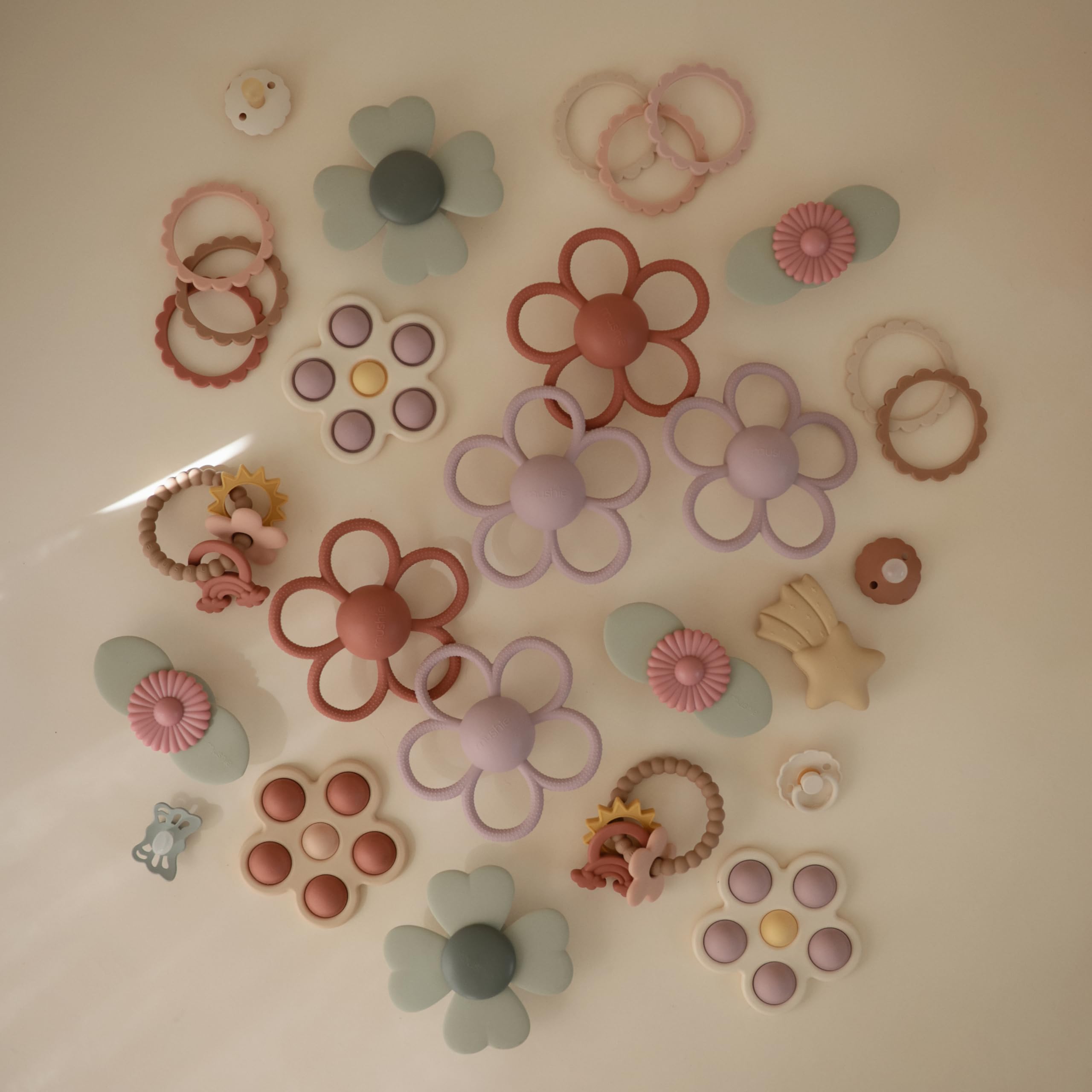 Mushie Daisy rattle teether made of safe non-toxic silicone materials.