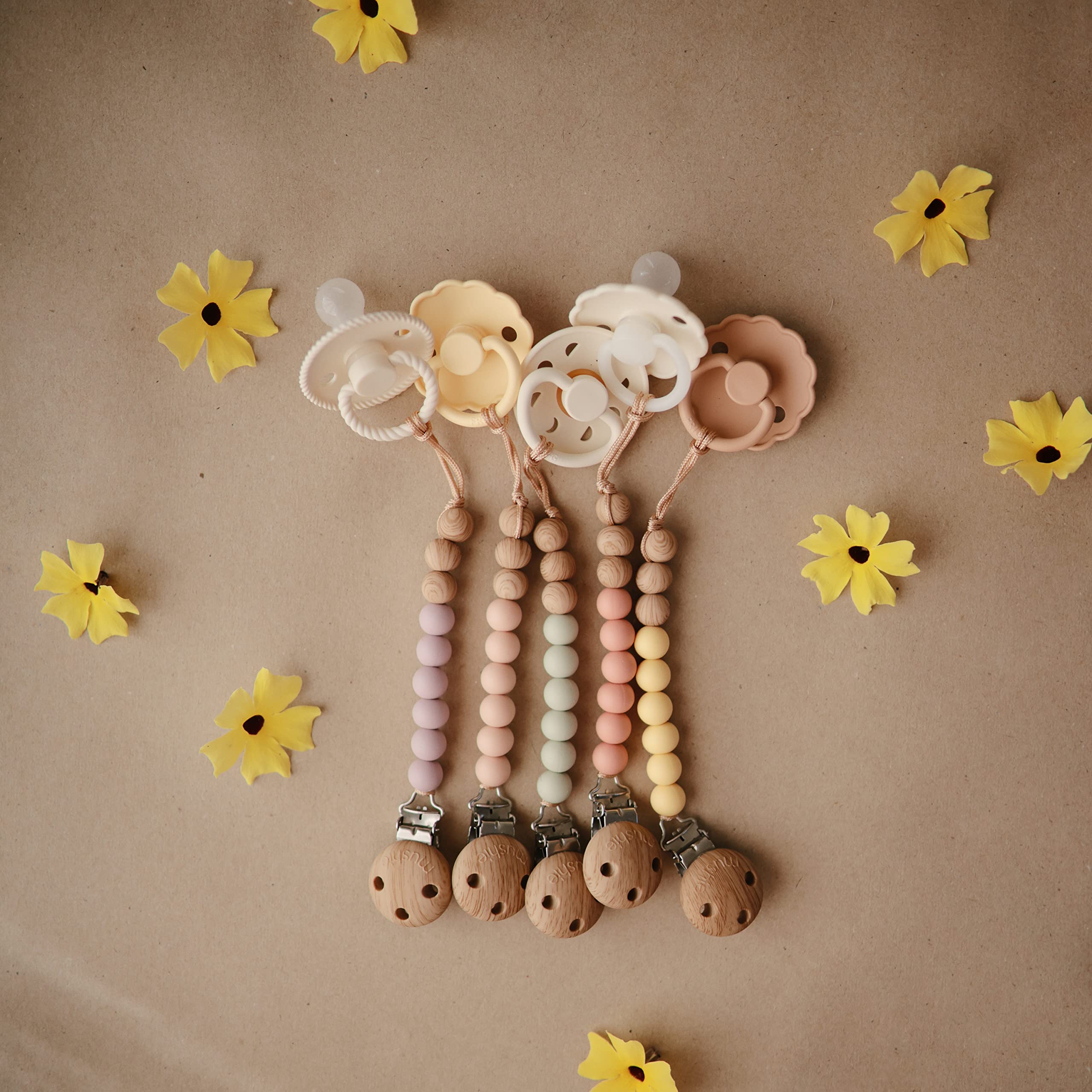 Mushie Eva baby accessory on the go, staying within reach.