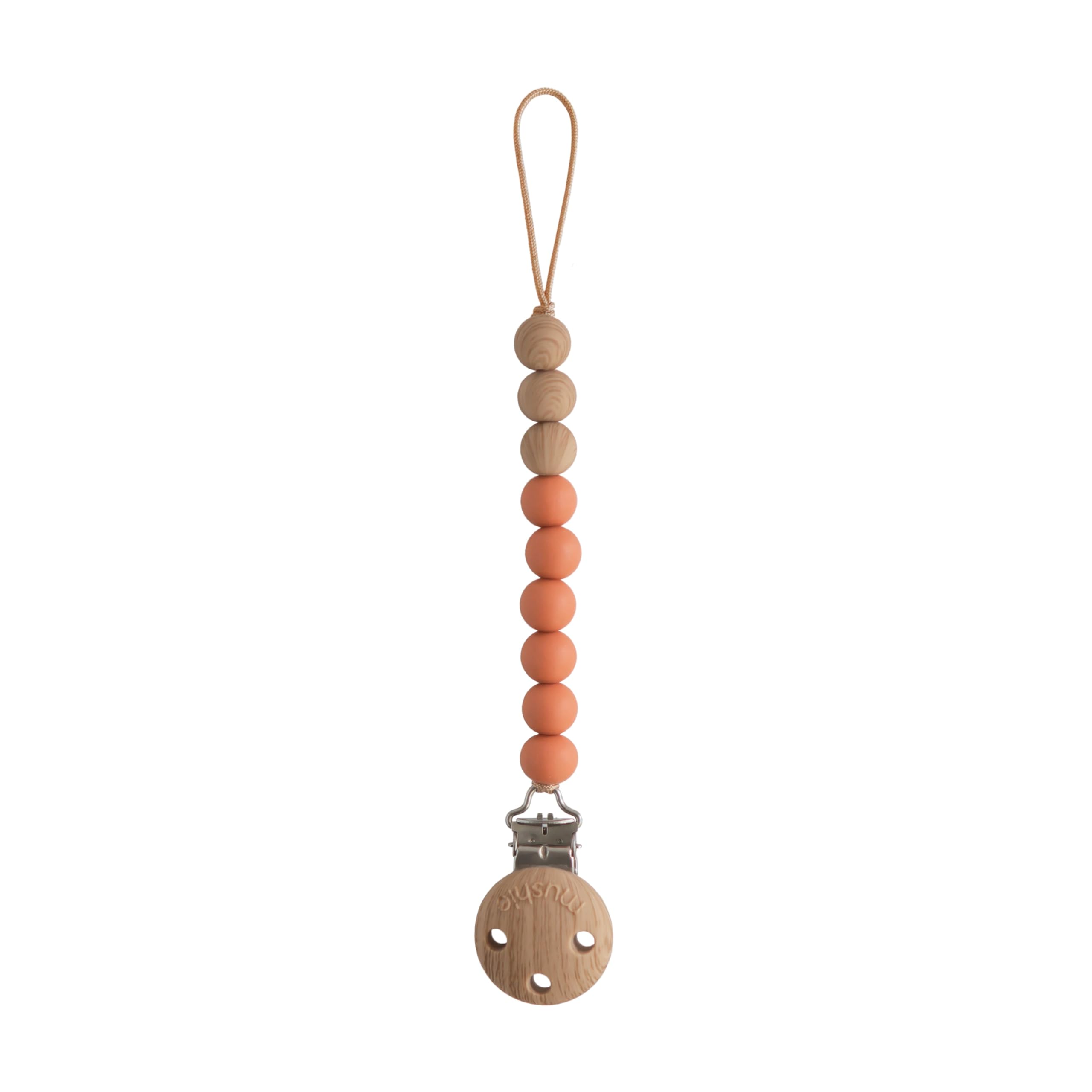 Mushie Eva clip beads closeup shows durable, BPA-free silicone for on-the-go soothing items.