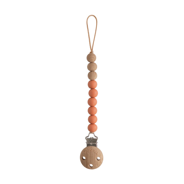 Mushie Eva clip beads closeup shows durable, BPA-free silicone for on-the-go soothing items.