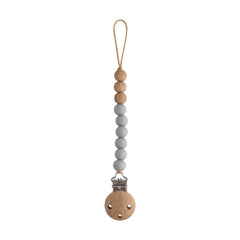 Mushie Eva clip with silicone beads for a durable, stylish pacifier attachment.