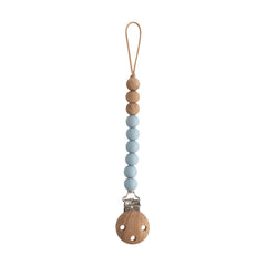 Mushie Eva silicone clip with a secure clasp for pacifier attachment.