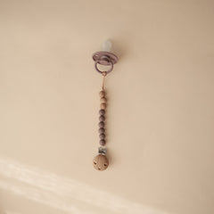 Mushie Eva pacifier clip beads displaying two-color silicone beads for style and function.