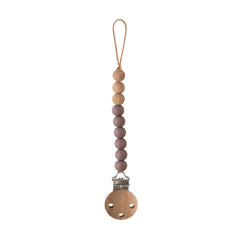 Mushie Eva pacifier clip closure with secure silicone clasp for on-the-go safety.