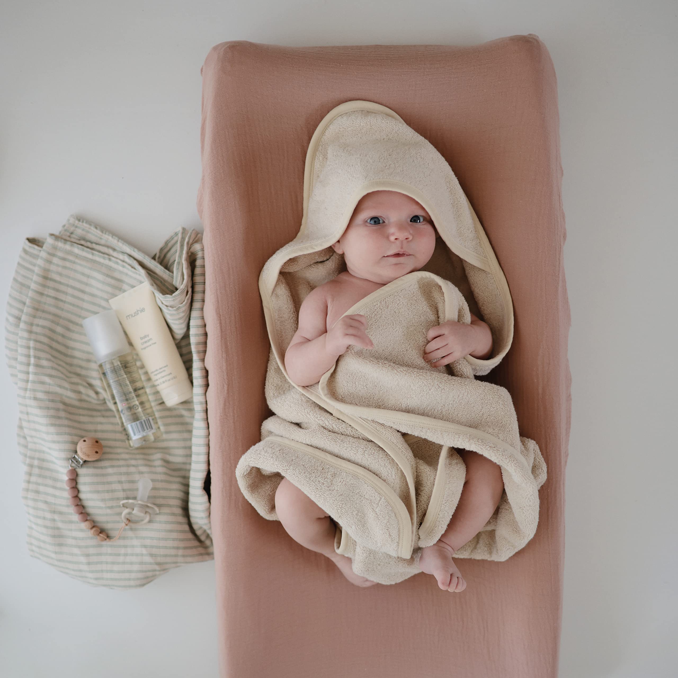 Mushie Eva pacifier clip length eight inches keeps essentials within reach.