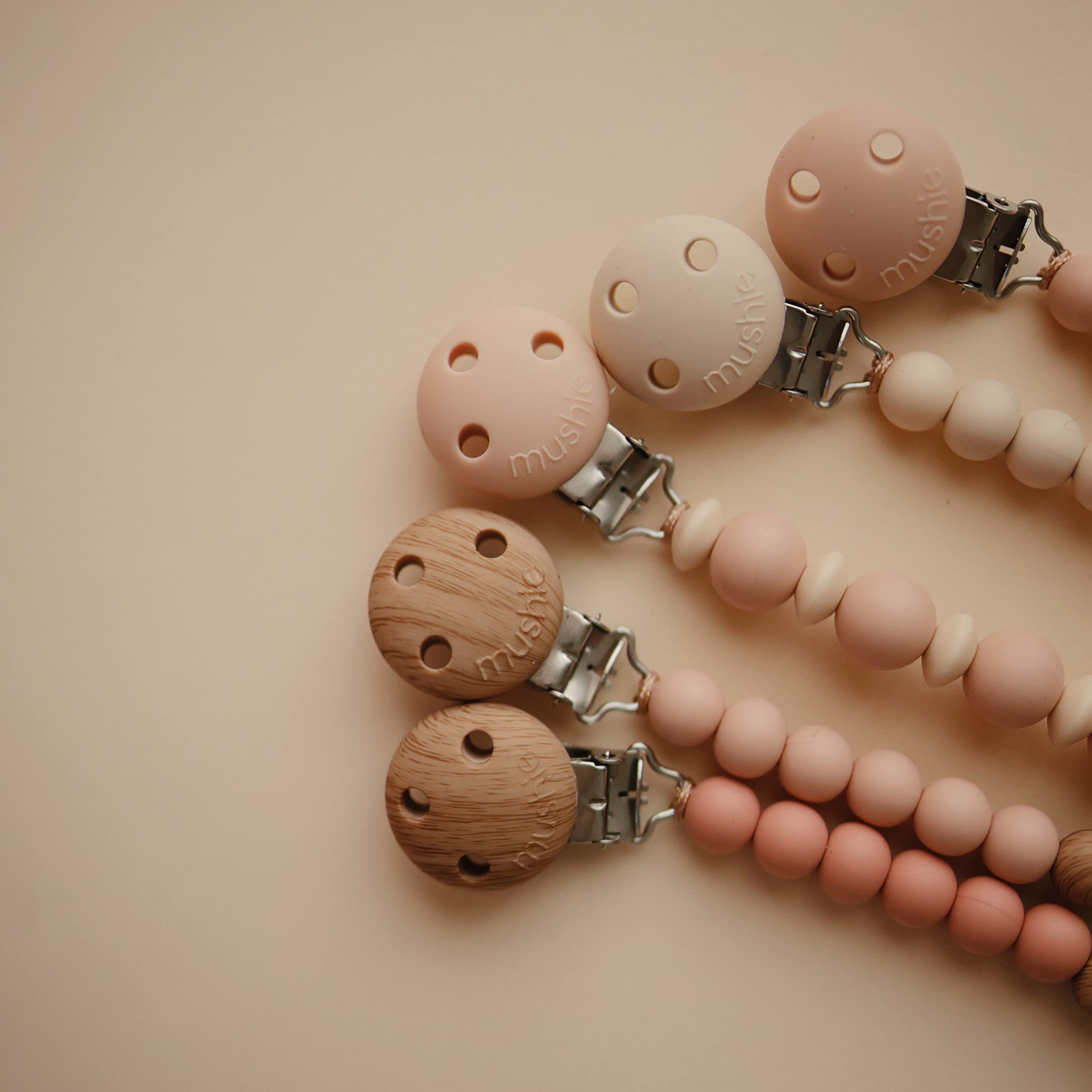 Mushie Eva silicone pacifier clip uses 100% food-grade material.