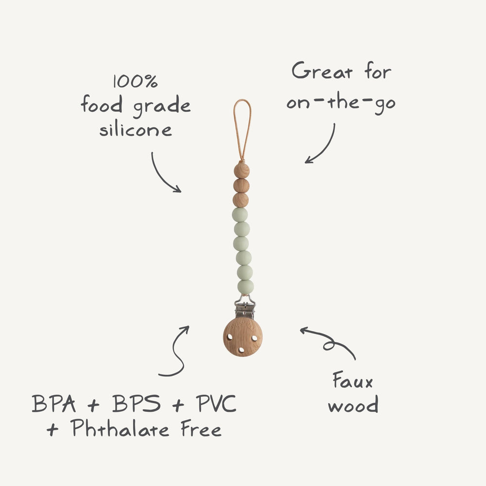 Mushie Eva pacifier clip safety-conscious design helps keep pacifiers within reach.