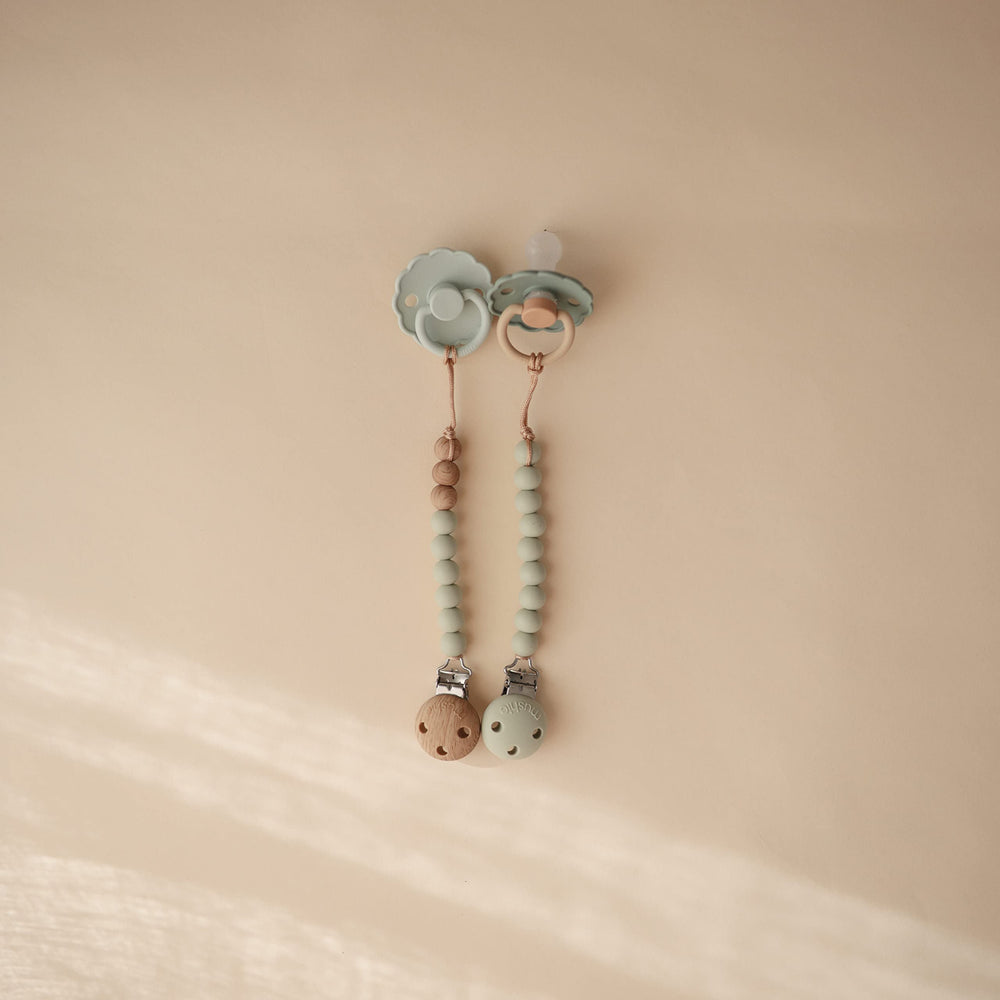 Mushie Eva Sage silicone beads showing color coordination for on-the-go use
