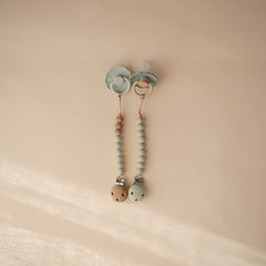Mushie Eva Sage silicone beads showing color coordination for on-the-go use