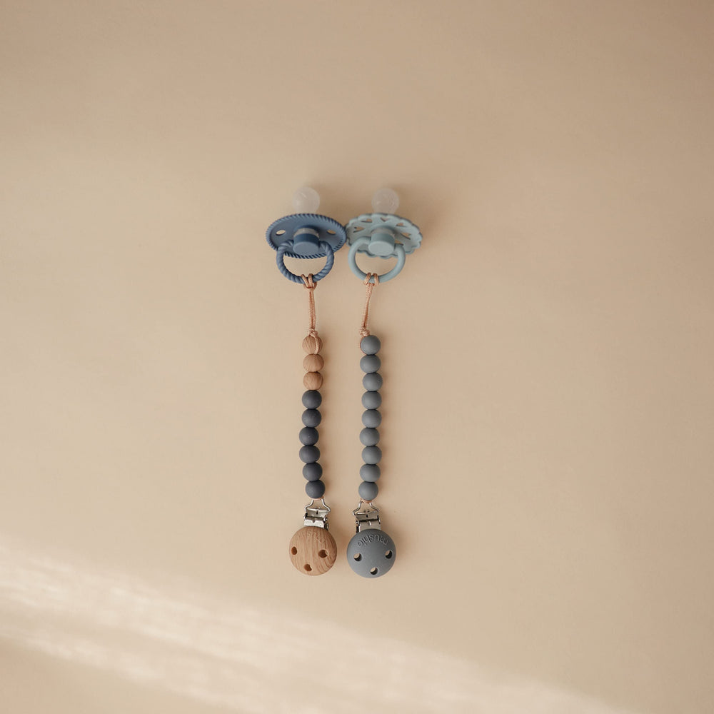 Mushie Eva clip close-up of two-color beads for a stylish accessory