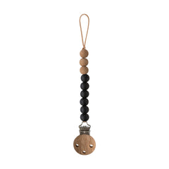 Mushie Eva silicone pacifier clip in black keeps pacifier within reach and tethers it safely.