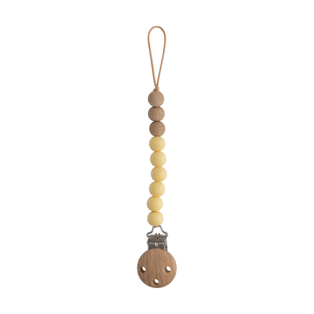 Mushie Eva silicone pacifier clip with wood clasp keeps pacifier secure and accessible
