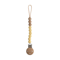 Mushie Eva silicone pacifier clip with wood clasp keeps pacifier secure and accessible