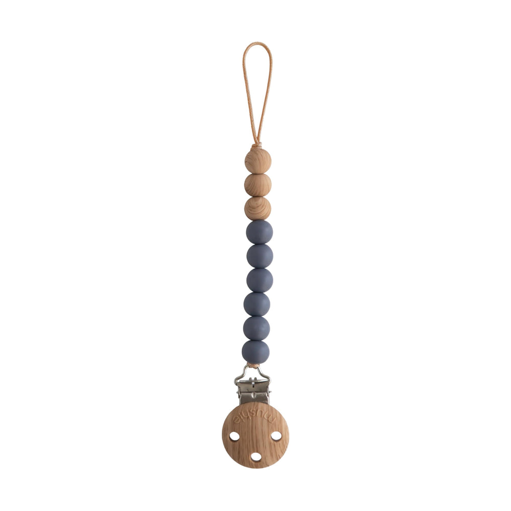 Mushie Eva silicone pacifier clip showing durable beads and safe, food-grade material