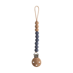 Mushie Eva silicone pacifier clip showing durable beads and safe, food-grade material