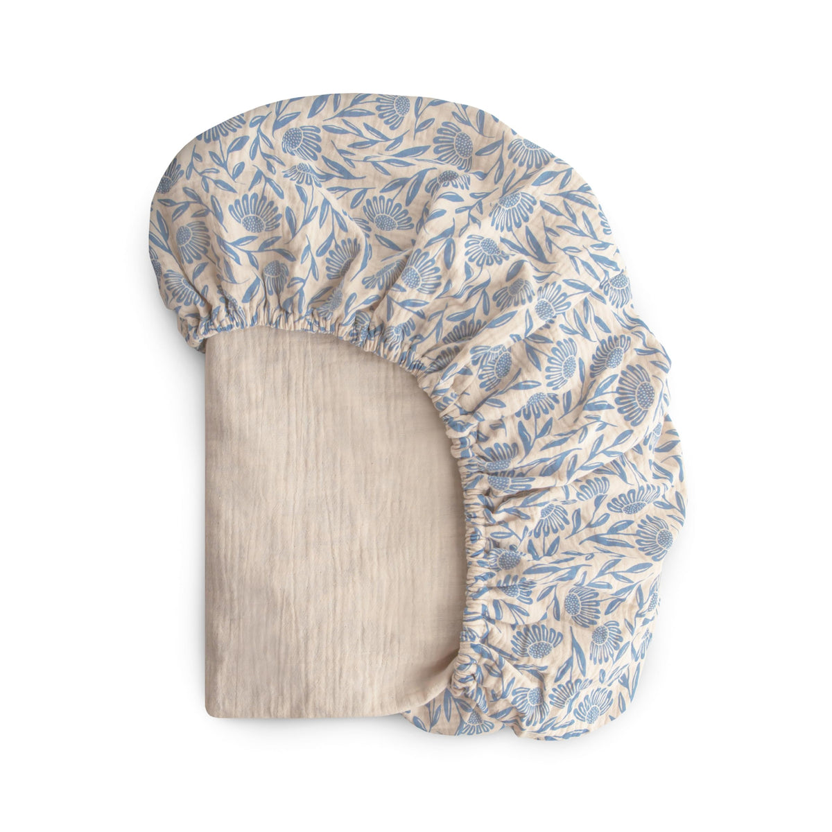 Mushie extra soft muslin fitted crib sheet in blue flowers for breathable baby comfort.