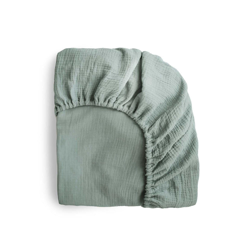 Mushie extra-soft muslin fitted MINI crib sheet on mattress for breathable comfort